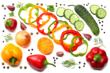 mix of sliced cucumber, garlic, sweet bell pepper and parsley isolated on white background. top view