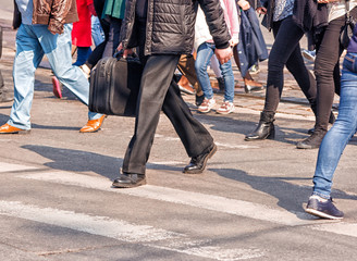 crossroad with walking pedestrians