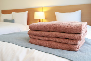 Fototapeta na wymiar Brown towels on bed