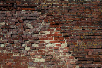 old brick wall with dumped bricks. Background, texture red brick. Vintage style. Space. Background for the designer. old brick masonry wall