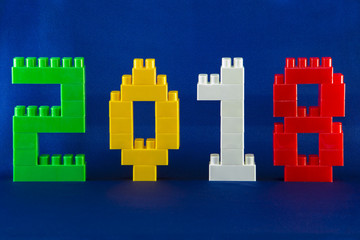 Tambov, Russian Federation - September 28, 2017 blocks New year 2018 concept with blocks cubes on blue background.