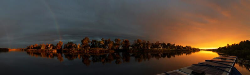 Sunset on the river in autumn