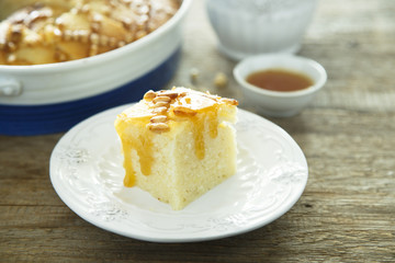 Semolina cake with pine nuts and rose water