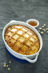 Semolina cake with pine nuts and rose water