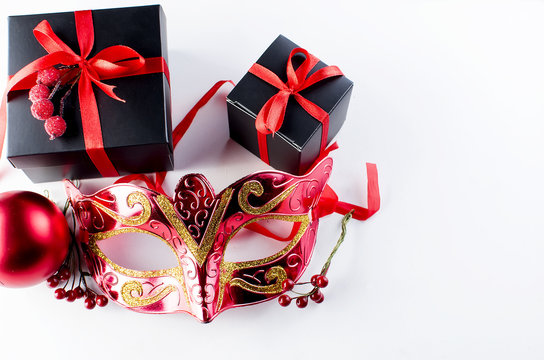 Black christmas  gift  box with red ribbon and nask