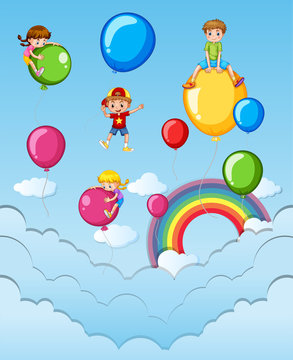 Happy children on colorful balloons in the sky