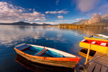 Beautiful morning landscape. Colorful vintage boats on Borovoe lake at Burabay National park in Northern Kazakhstan.