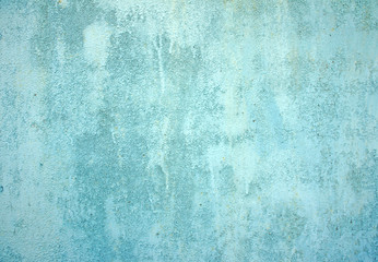 Light blue plaster wall texture background, close up