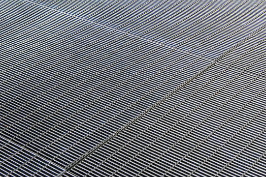 Metal steel grid texture on the ground