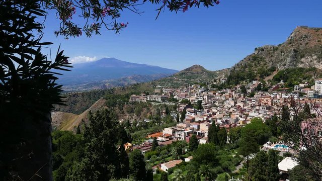 The town of Taormina in Sicily with the mount Etna in the background