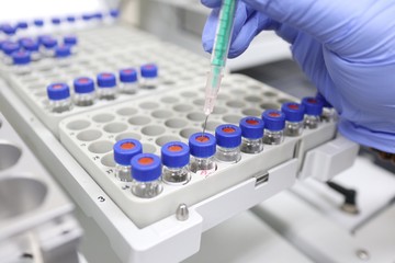 A syringe for injecting a sample into a tube set in gas chromatography for chemical analysis
