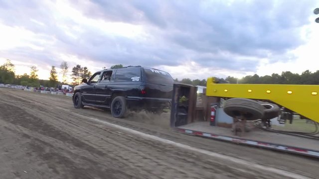 truck pull contest denali bouncing across dirt 4k gimbal follow