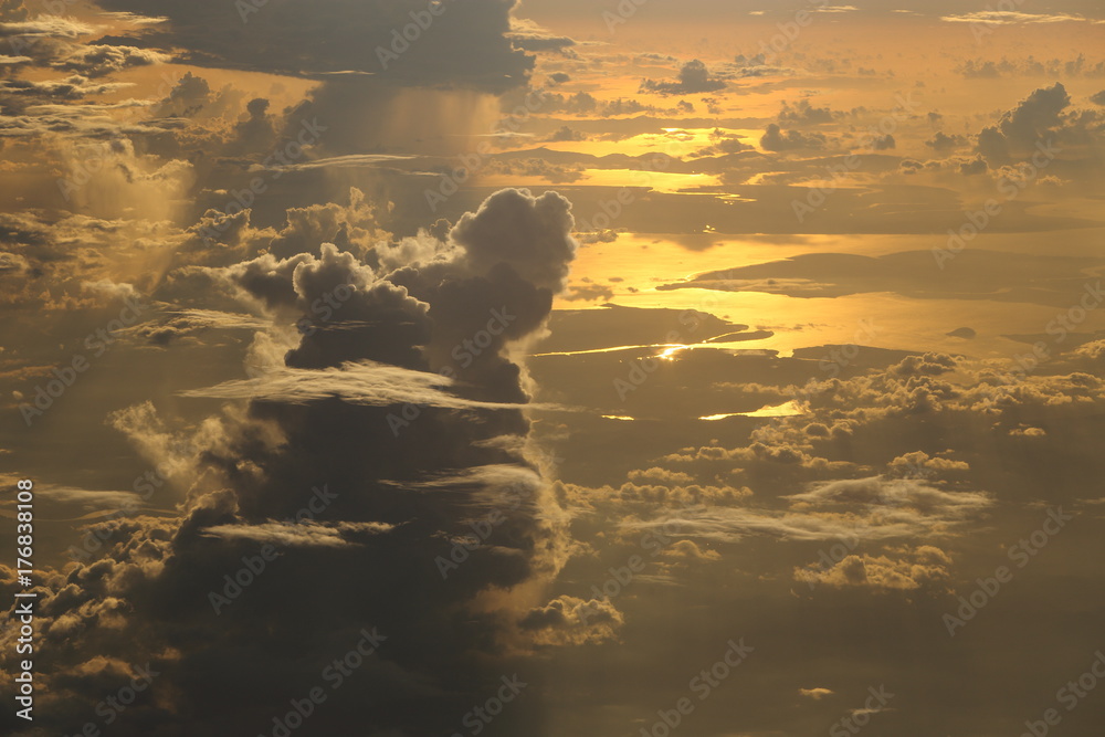 Wall mural sunset white cloud sky at high level attitude, view from window airplane