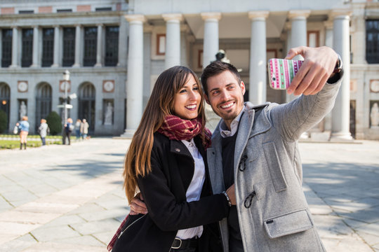 couple taking selfie at prado museum madrid