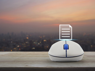 Document icon with wireless computer mouse on wooden table over blur of cityscape on warm light sundown, Business communication concept