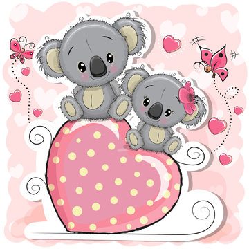 Two Koalas is sitting on a heart