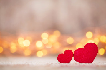 Red hearts on the wooden background.