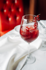 red cocktail with cranberries
