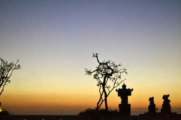 Hindu altar and sunset in Kuta, Bali, Indonesia