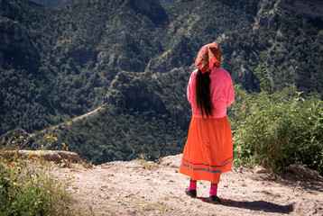 Tarahumara woman wearing bright traditional outfit is seen in Copper Canyons, Chihuahua, Mexico