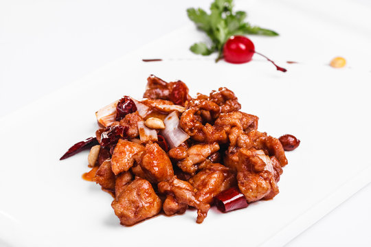 Sweet and sour chicken on a white plate