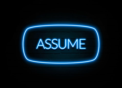Assume  - colorful Neon Sign on brickwall