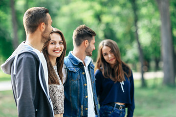 Happy young couples spend fun time outdoors. Love and friendship