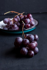 Black grape on a black background