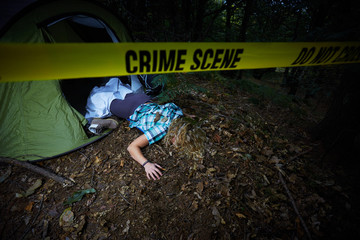 young woman lying dead in a forest after rape 