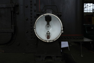 Detail of the steam engine lamp with bulb and burner