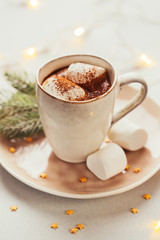 Mug filled with hot chocolate and marshmallows. Christmas background. Vintage toning.
