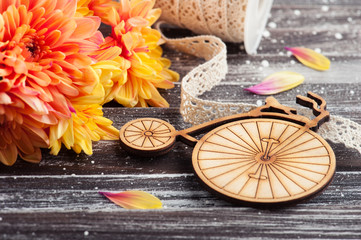 Orange chrysanthemum and wooden bike