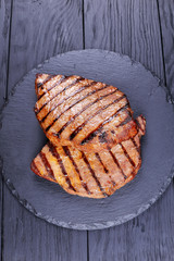 two grilled  beef steaks with stripes