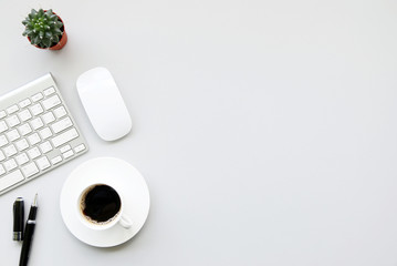 Coffee cup and keyboard cactus On the white desk copy space for your text.