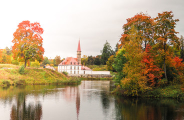 Obraz premium Landscape with old castle in a beautiful landscape. Priory Palace in Gatchina. Russia.