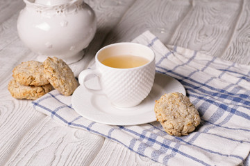 Obraz na płótnie Canvas Oatmeal cookies with cocos and green tea
