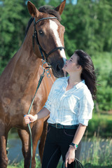 Obraz premium young girl with her horse posing together