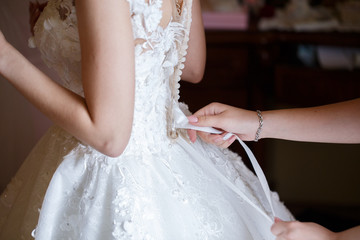 beautiful bride dress decorated with beads and lace