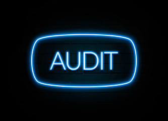 Audit  - colorful Neon Sign on brickwall