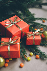 christmas composition, spruce branches to gifts in red boxes, christmas decor