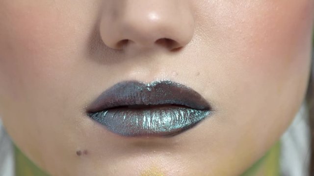 Dark lips close up. Sexy lips of young woman.