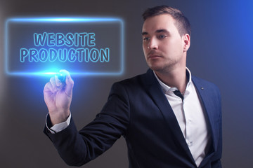 The concept of business, technology, the Internet and the network. Young businessman showing inscription: Website production