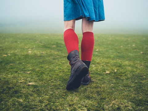 Woman in hiking boots and socks on the moor