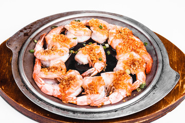 Cooked king prawns on a plate on white background, top view, Asian food