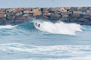 Bodyboarder surfing ocean wave