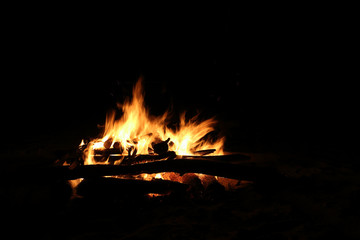 Bonfire burning on a dark background