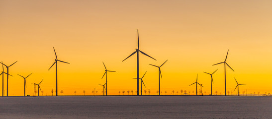 wind generators in sunset