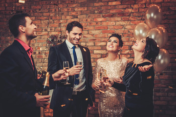 Happy beautiful couples celebrating Christmas