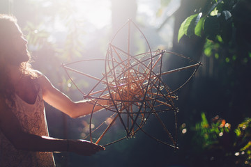 The artist working on handmade lotus capacitor sculpture from bamboo
