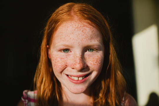 Portrait of redhead girl with freckles